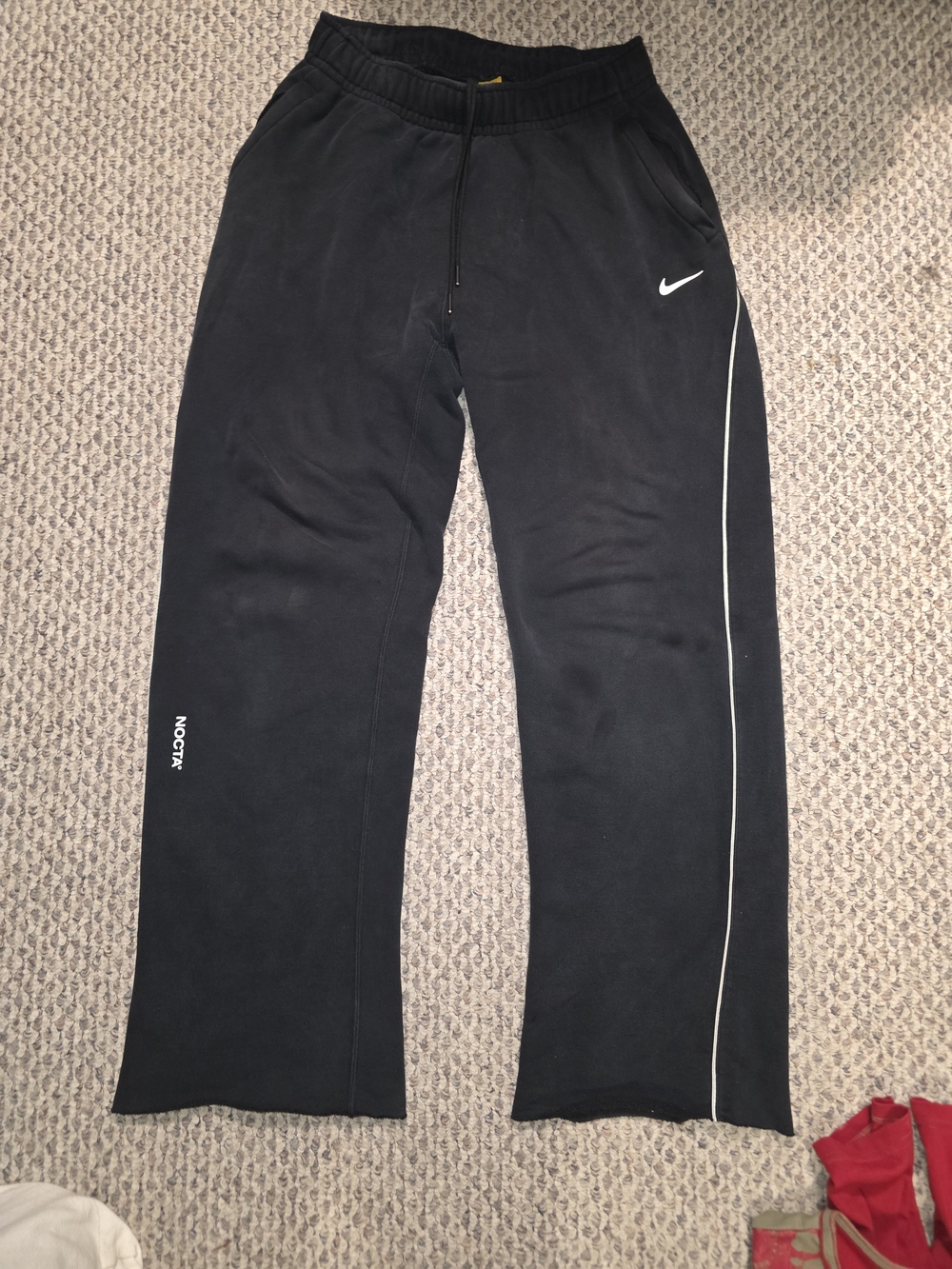 Nike Nocta Black Jogger Sweatpants with White Swoosh and Side Piping